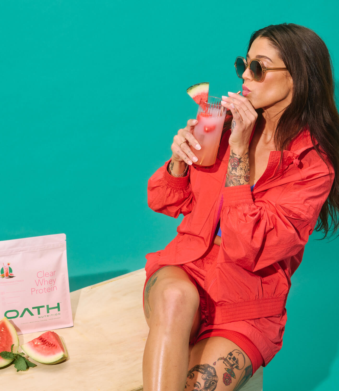 Cool girl drinking delicious Oath Clear Whey Protein - Watermelon Fresca