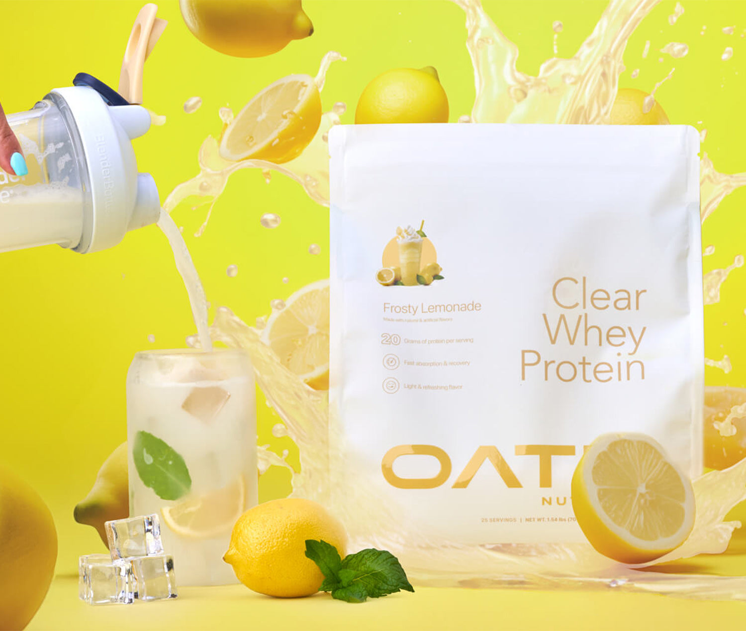 Oath Clear Whey Protein - Frosty Lemonade bag with lemons and lemon protein bursting in the background. A BlenderBottle protein shaker pours clear whey into a glass.