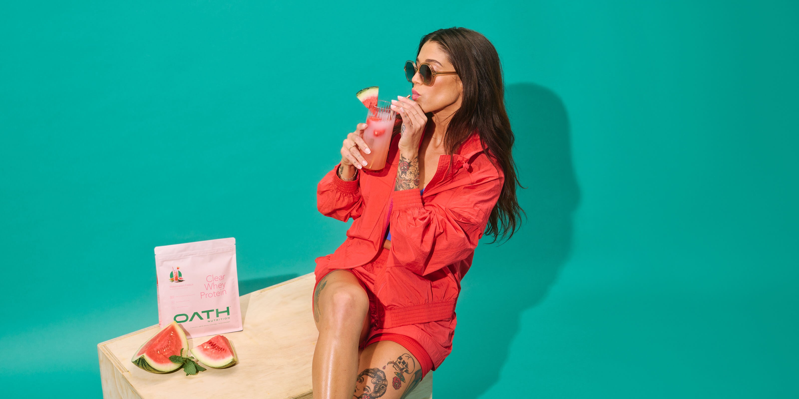 Cool girl drinking delicious Oath Clear Whey Protein - Watermelon Fresca