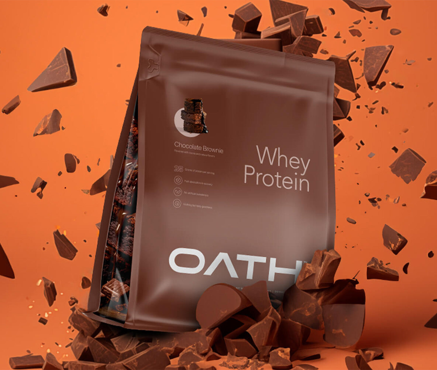 Oath Chocolate Brownie Whey Protein bag with bits of chocolate all around it
